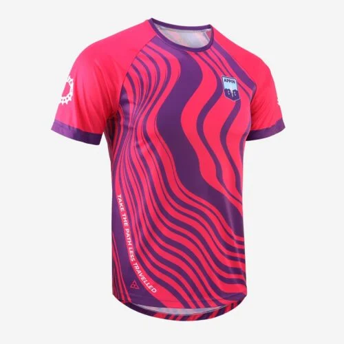 Front view of a short sleeved cycling top with pink and purple swirl design and small bage logo on chest