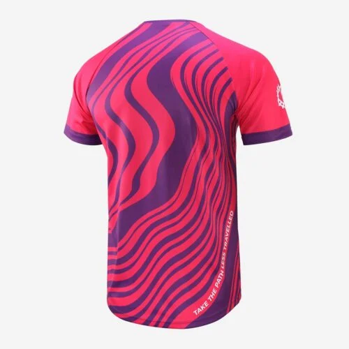 Rear view of a short sleeve mountain bike top in a purple and pink swirl design