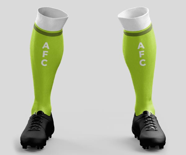 Knee length football socks with contrast band at top, and 3-lettered logo design on front shin