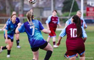Women’s football players wearing different fit styles of women’s football kits during a match
